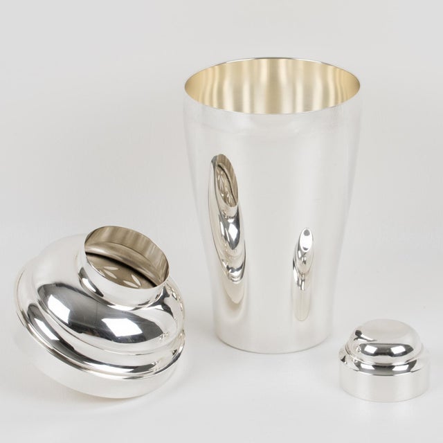 This superb three-section cocktail shaker was crafted by the renowned silversmith Saint Medard in Paris. The beautiful Art...