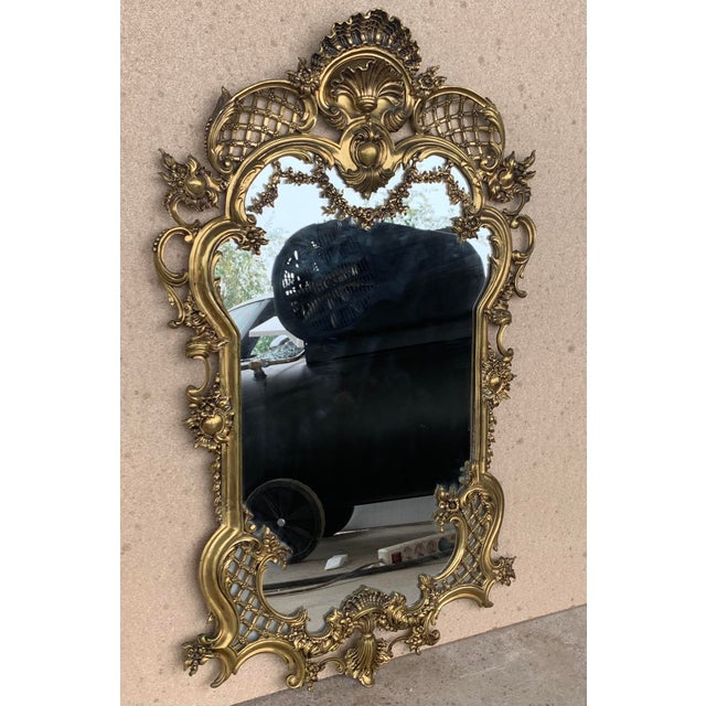 19th French handmade bronze mirror with reliefs. Details Dimensions Height: 41.34 in. (105 cm) Width: 25.79 in. (65.5 cm)...