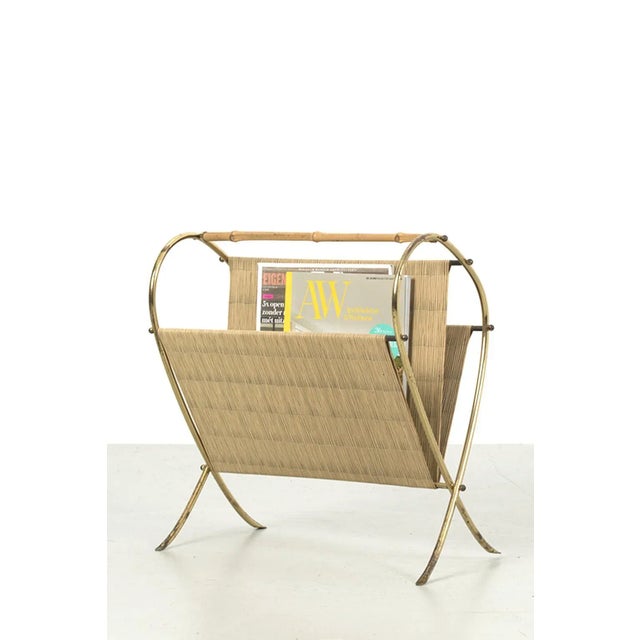 Nice vintage magazine holder made or brass with bamboo. Has two compartments for your magazines. Has some traces of use...
