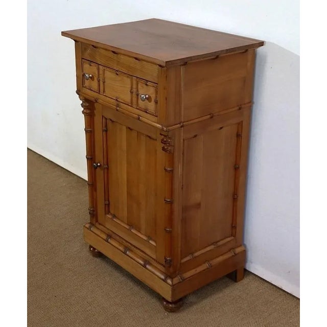 Atypical small Art Nouveau furniture in solid cherry wood, using the bamboo design of the 1900s. This unusual piece of...