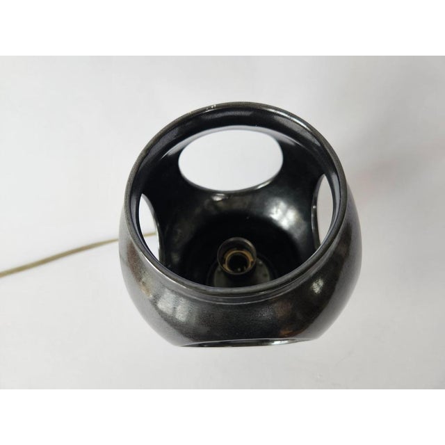 Very rare table lamp. Space age style. Beautiful style of lighting. Marked by label. This piece is attributed to the...