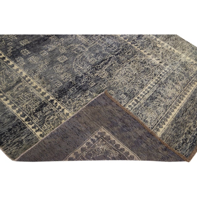 This Beautiful transitional handmade wool rug makes part of our Northwest collection and features a gray color field and...