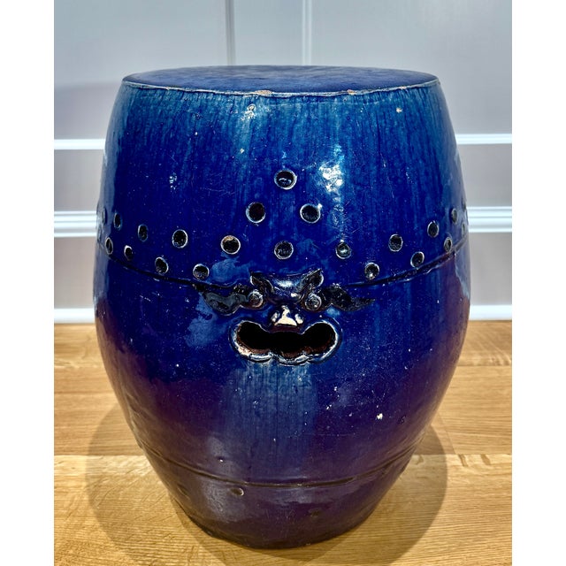 A striking early 20th century Chinese export garden stool, glazed in a rich cobalt blue with subtle tonal variations that...