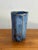 Handmade blue pottery mug, with a folk art style and a pattern reminiscent of fish scales. Signed by maker. Most items...
