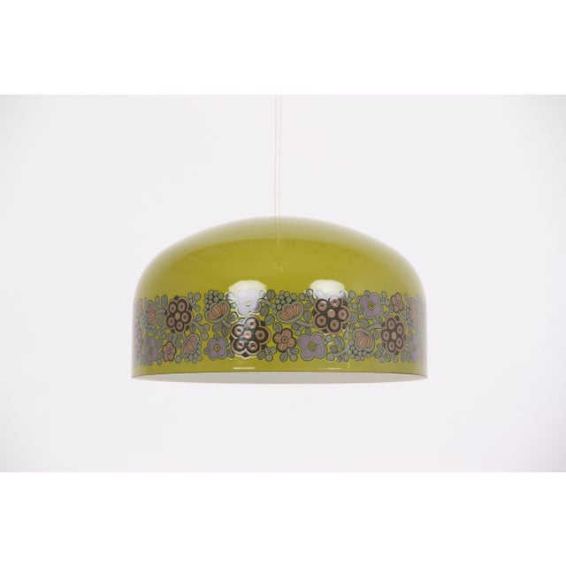 Kaj Franck designed this beautiful metal pendant lamp with an attractive pattern. A typical 1960s pendant lamp in good...
