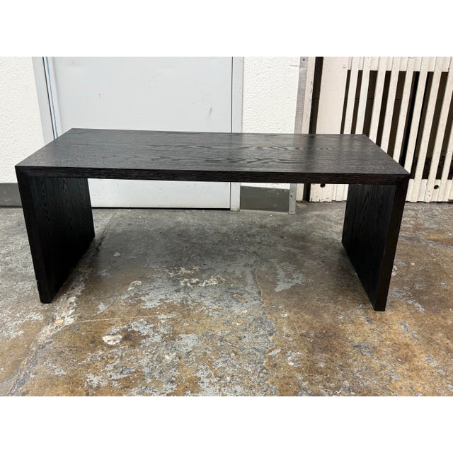 Design Plus Gallery presents a Cloud Waterfall Coffee Table by Restoration Hardware. This modern table has a waterfall...