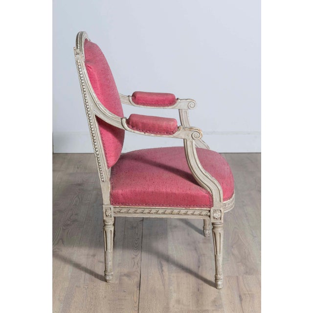 French Louis XVI Style 19th Century Painted Fauteuil with Abundant Carved Décor For Sale - Image 4 of 10