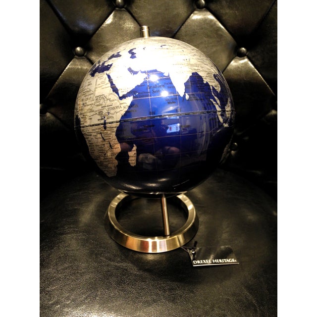 Add timeless mid-century sophistication to your space with this striking vintage globe by Drexel Heritage. Featuring a...