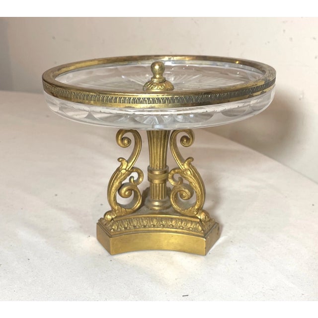 Up for sale is a wonderful antique ornate French footed candy dish/ card receiver. It has a very ornate gold gilded bronze...
