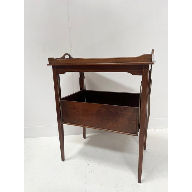 Louis xvi style mahogany serving table four tapered legs joined by a stretcher lower top with four drop-leaf shelves...