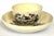 18th-century English George III creamware matching set of tea bowl and saucer featuring black transfer-printed country...