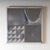 Set of two square wall panels, each composed of four metal tiles featuring various geometric and abstract relief designs....