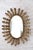 Gilt metal sunburst mirror, Spanish work dating from the 1960s. The particularly refined decoration consists of acanthus...