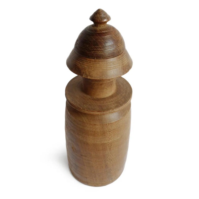 Antique Nepalese Tekhi storage jar handcrafted from solid wood with a beautifully aged natural patina and traditional...