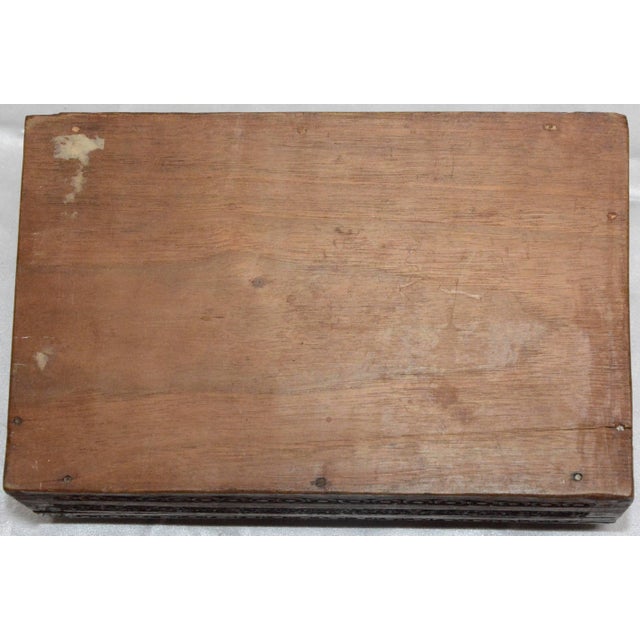 A lovely floral design tops this intricately hand-carved rosewood tea caddy. The lid opens to two sections to store your...