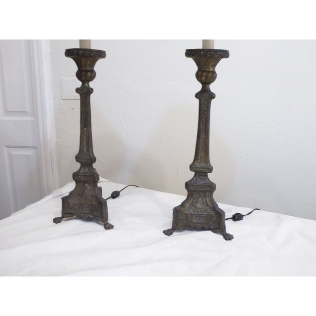 This pair of Continental silvered bronze candlesticks were electrified and use up to 100 Watt Edison base bulbs, they are...
