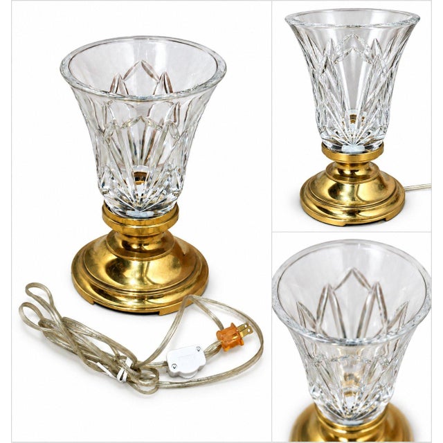 Elegant vintage table lamp combining a sparkling cut crystal shade with a warm polished brass base. The crystal features...