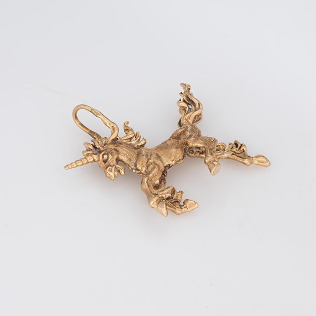 Distinct & stylish vintage Unicorn pendant crafted in 10 karat yellow gold (circa 1970s). The elaborate unicorn features a...