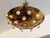 A wonderful pair of 1960s French solid brass round disc fixture with 16 solid glass orbs. Five-light sources which emit...
