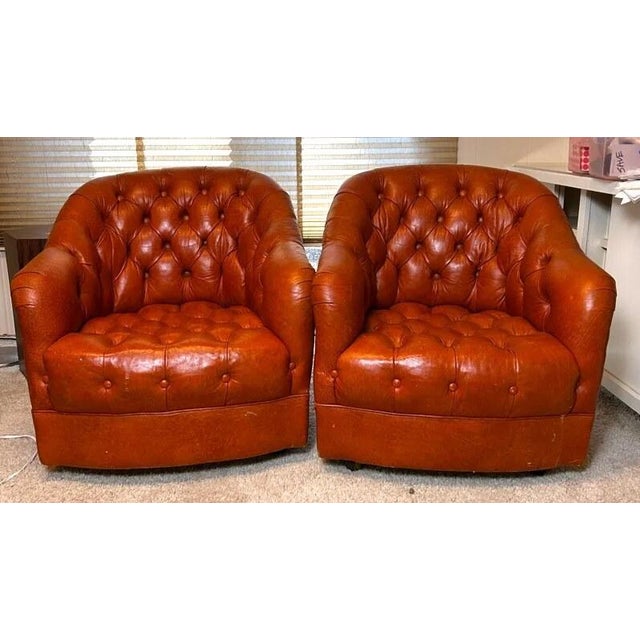 This handsome vintage pair of barrel-back club chairs was handcrafted by Classic Leather Inc. (Hickory/Conover, North...