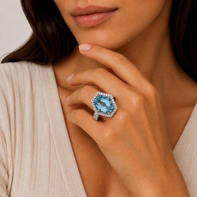 18k White gold ring with 19.98 carat "Santa Maria" Aquamarine and 59 round brilliant diamonds weighing 1.59 carats, Signed...