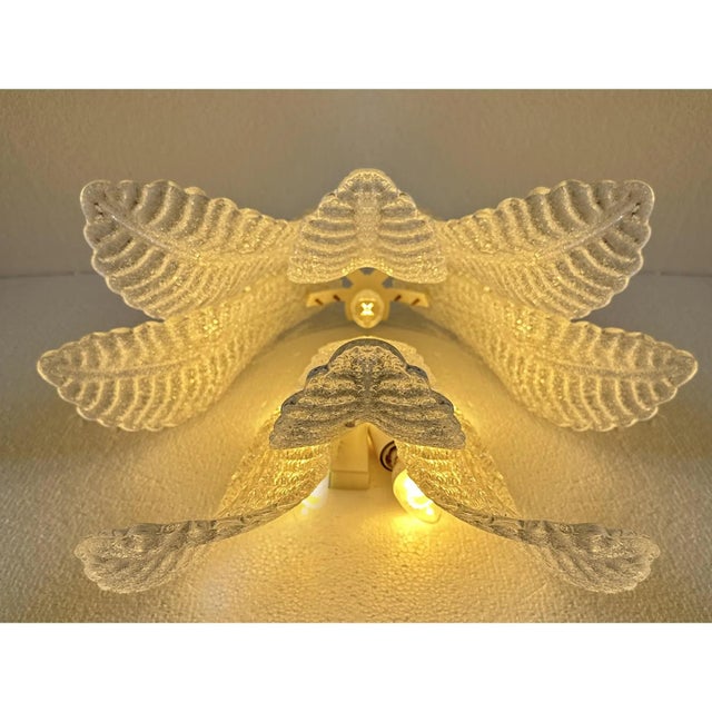 Shenographic wall sconce in murano glass. Leaves in gold graniglia, metal frame in white. a piece of hight italian hand-...