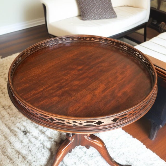 Crafted by Imperial Furniture of Grand Rapids, this vintage solid mahogany table is an elegant blend of Federal and...