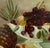 Summer Fruit Still-Life with Cherries, Peaches & Pineapple - After H. Raymond A lovely still-life featuring an opulent...
