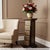 Dimensions: 11” W x 11” D x 27” H Sculptural, functional, and rich in artisan detail — this striking wooden pedestal is...
