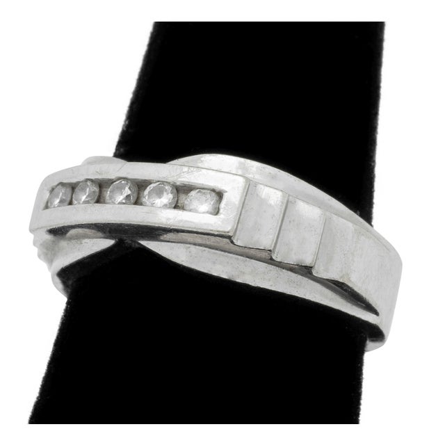 14K White Gold Diamond Channel Ring, featuring 5 channel set round brilliant cut diamonds, weighing a total of approx....