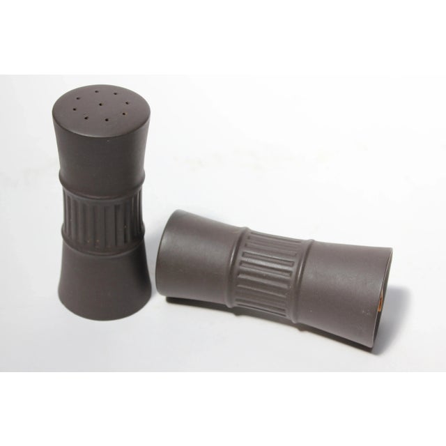 Danish 'Flamestone' earthenware salt and pepper shakers by Jens H. Quistgaard for Dansk designs, circa 1958-1964. Features...