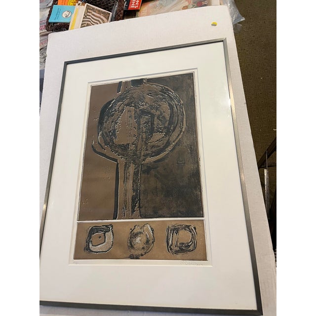 An impressive limited edition and signed P. Eisenberg abstract silkscreen in black and brown. Nice metal frame.