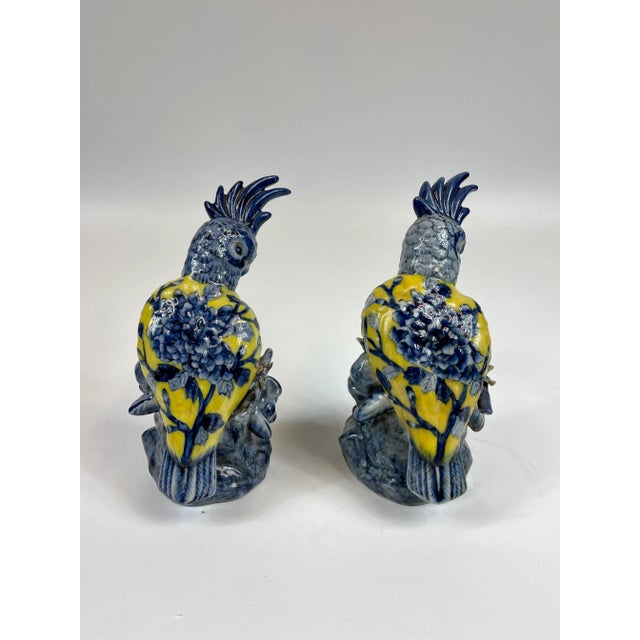 A pair of beautiful blue and yellow cockatoos. Hand painted - due to the nature of it being hand painted there are slight...
