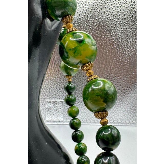 Boho Chic 1950s Bakelite Pendant Necklace With Green and Yellow Marbled Beads and a Gold Tone Monkey Pendent Holding Beads Excellent Pre Owned Condition For Sale - Image 3 of 12