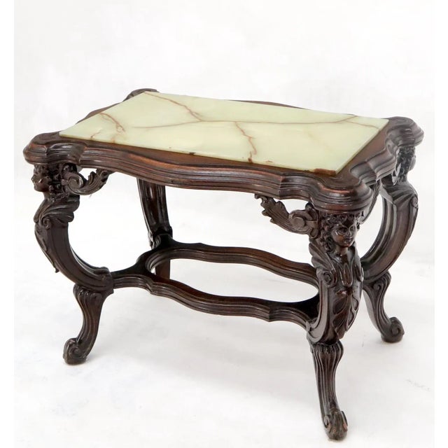 Fine detail carved walnut cherubs base onyx top side occasional table.