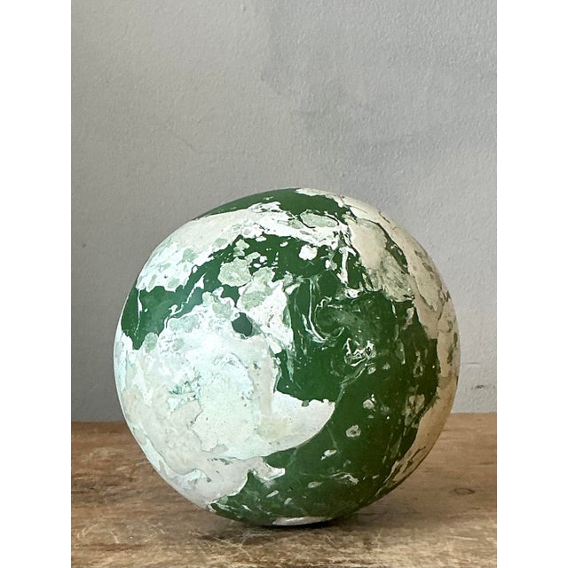 Introduce a touch of earthy, artisanal elegance to your home with this captivating scagliola sphere. Expertly crafted...