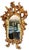 A dramatic statement piece, this monumental giltwood mirror captures the elegance of Rococo revival design, likely from...