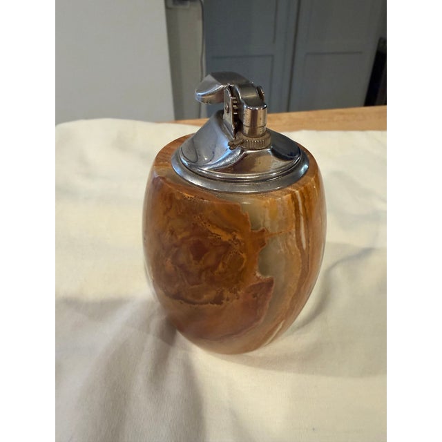 Beautiful and heavy onyx table lighter that is barrel shaped and made in Italy. Chrome lighter fixture.