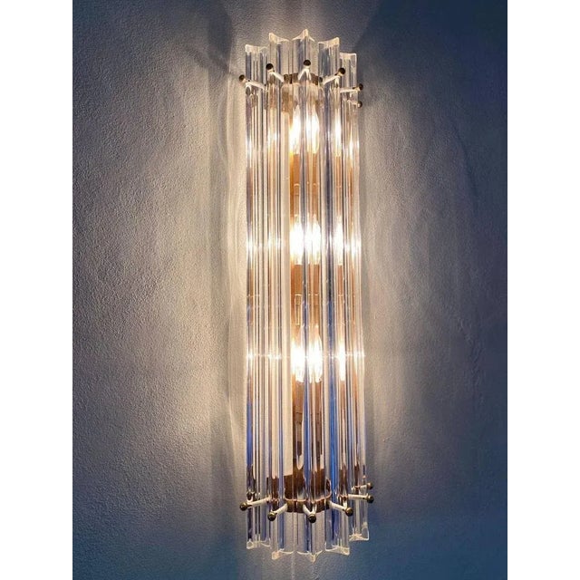 Pair of wall lights in Murano Glass Cane Hand -pulled transparent color in the shape of a triedrum. Three lights with E14...