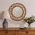 Beautiful wavy rattan circular mirror from Italy, 1960s. Unique design with wavy zig-zag rattan encompassing the mirror....