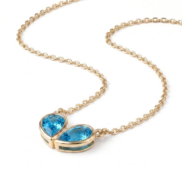 Contemporary Classic Bezel-Set Twin Teardrop Blue Topaz Pendant in 925 Silver For Sale - Image 3 of 4
