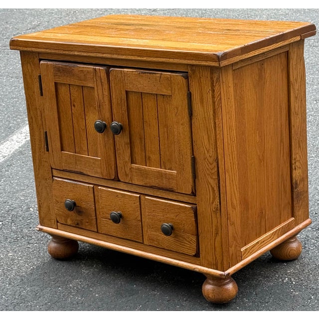 Charming rustic farmhouse style nightstand by Broyhill. Features heavily distressed oak construction, storage cabinet,...