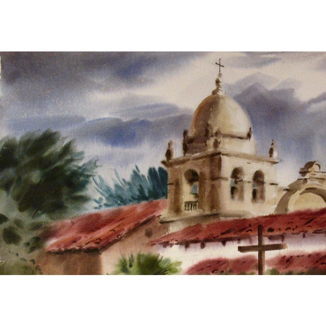 This artwork Titled "Mission San Carlos Borromeo de Carmelo, Carmel, California" c.1970, is a large watercolor on heavy...