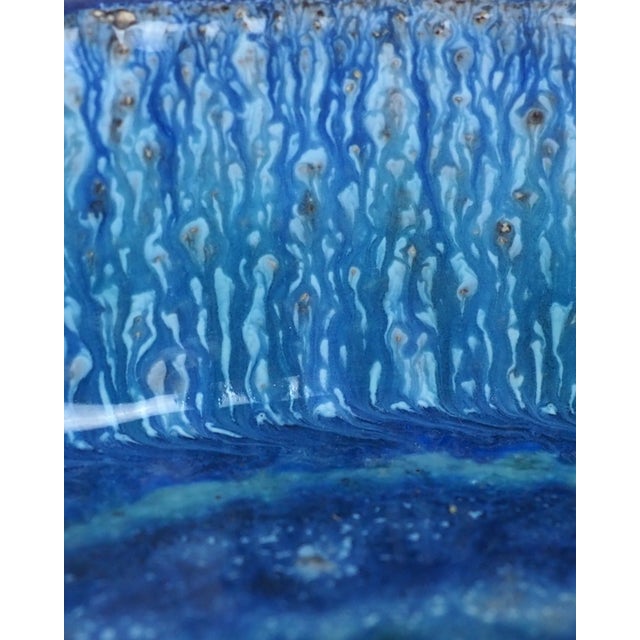 A ceramic bowl from the Danish manufacturer Bangholm, highly sought after by collectors. The simple form and intense blue...