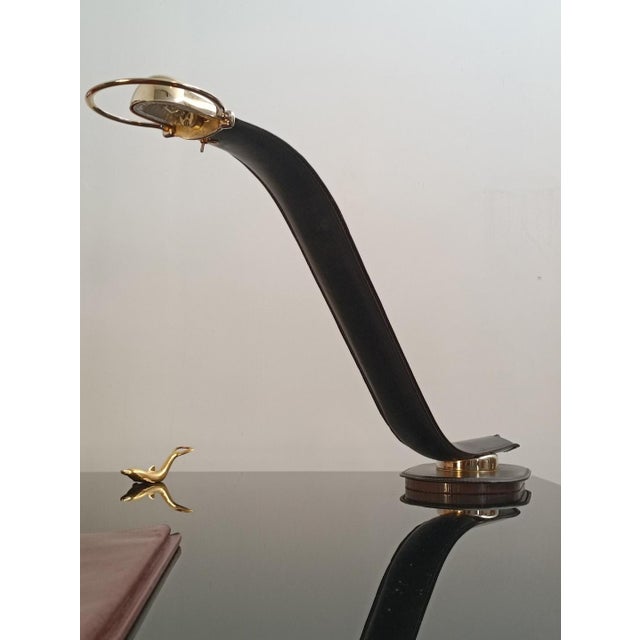 Magnificent and rare Cobra desk lamp by Traso Milano. Italy, 1988. The base is covered in saddle-stitched leather, very...