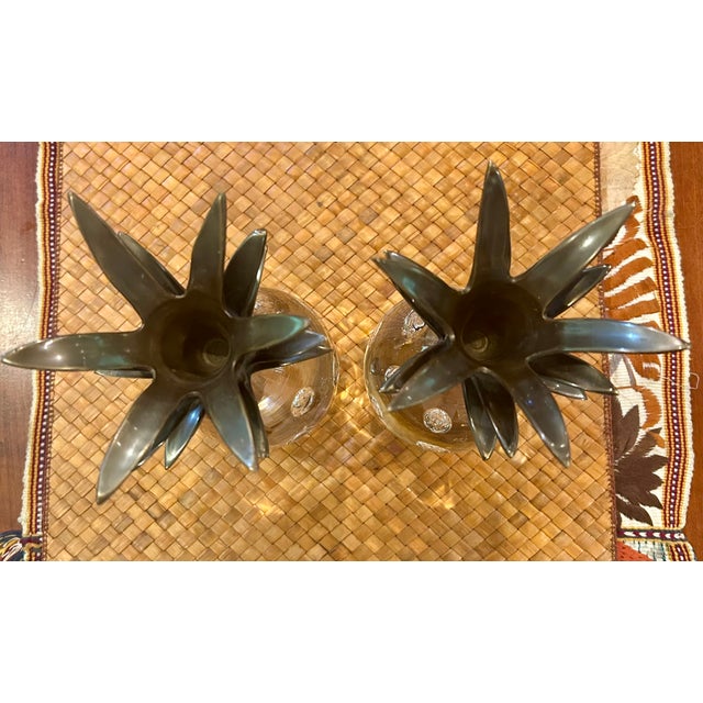 Offering a classic pair of leaded glass pineapple candle holders featuring trapped bubbles in the glass and topped with...