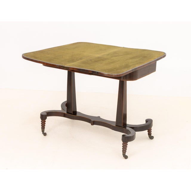 Regency Rosewood and Mahogany Card Table, with flip-top opening to green felt square table top above two supports on...