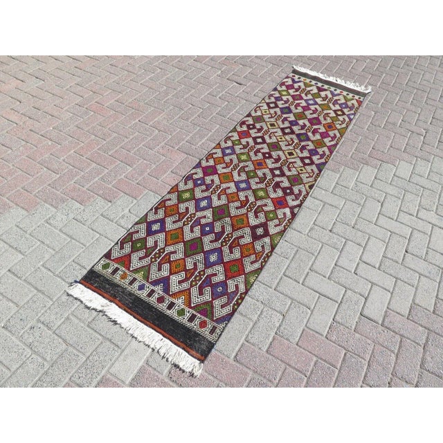 This beautiful, traditional vintage, hand knotted Turkish runner is approximately 60 years old. It is handmade of very...