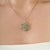 This Art Nouveau-inspired pendant is crafted in 925 sterling silver and features 1.25 carats of round-cut tsavorite...
