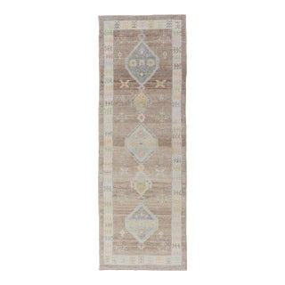 Turkish Oushak Runner With Soft Brown Field and Pale Blue Geometric Medallions For Sale